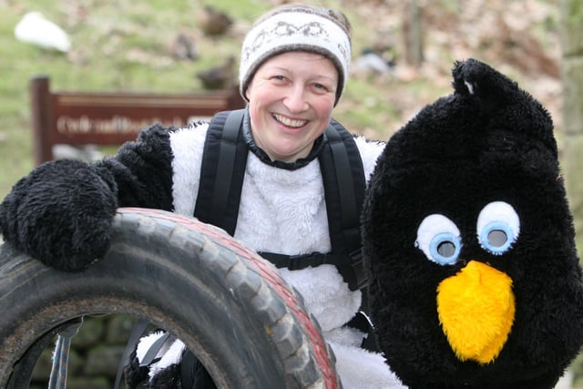 Visitors to the Fairholmes Visitor Centre at Ladybower Reservoir on New Year's Day 2009 could have been forgiven for thinking they had over-indulged in their celebrations with the sight of Helen Turton, dressed as a penguin and pulling a tyre, as she trains for her skiing expedition to the South Pole.