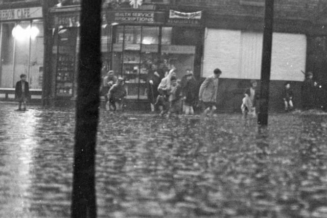 A thunderstorm brought this flooded scene to Ocean Road in May 1953. Remember it?