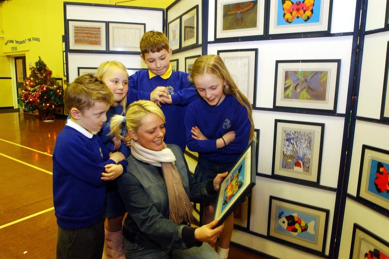 These paintings were created by pupils at the school 17 year ago but were you pictured looking at them when they went on display?
