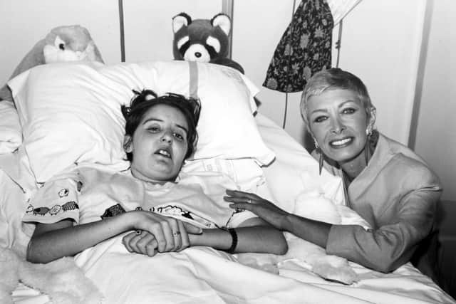 Marti Caine with cancer patient Lisa Ashton at Weston Park Hospital, Sheffield in August 1995