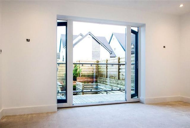 The doors open up onto a balcony.