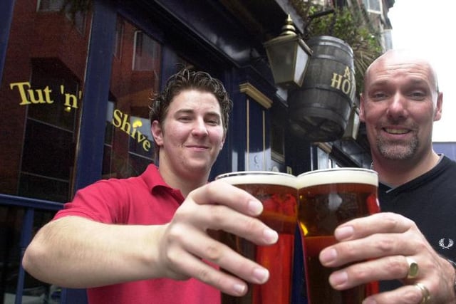 Tut 'n' Shive was voted the CAMRA's pub of the season for autumn 2001. Nick Coster and Andrew Butler here celebrating the award with a pint.