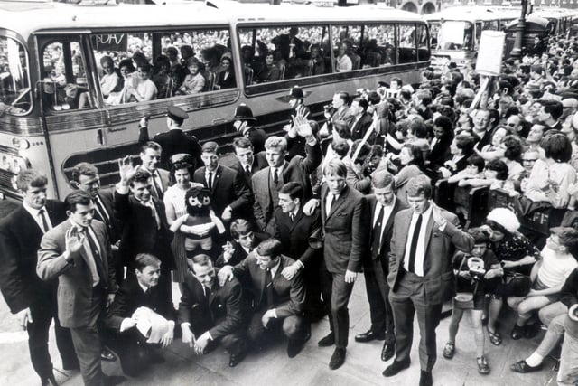 Sheffield Wednesday players pose for photographs outside the Town Hall on their return to Sheffield after the FA Cup Final at Wembley.
Everton won the competition for the third time, beating Sheffield Wednesday 3-2, May 16, 1966