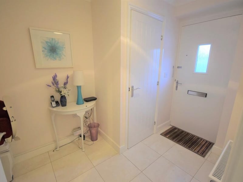 Light and airy entrance & hallway, with internal door to downstairs WC and wash handbasin