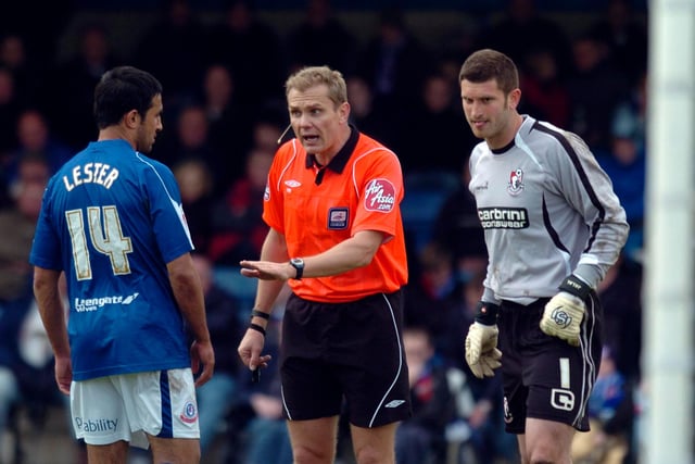 Referee Graham Scott calms down Lester after a collision with then Bournemouth goalkeeper Shwan Jalal in 2010.