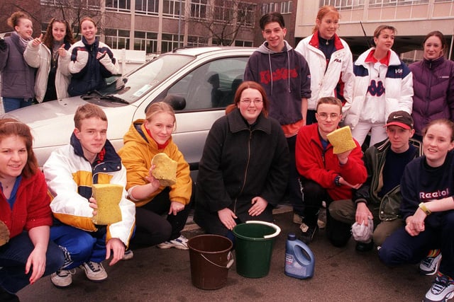 Doncaster College students, buckets and sponges at the ready, prepare to start the fund-raising car wash in 2000