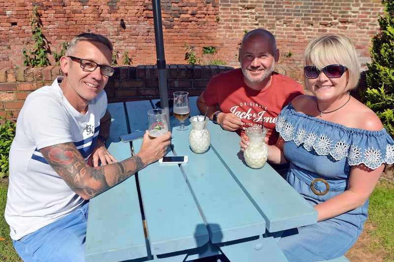Enjoying the sunny beer garden at The Junction bar on Chatsworth Road. Chris Longson, Tracie Booth and Steve Mills.