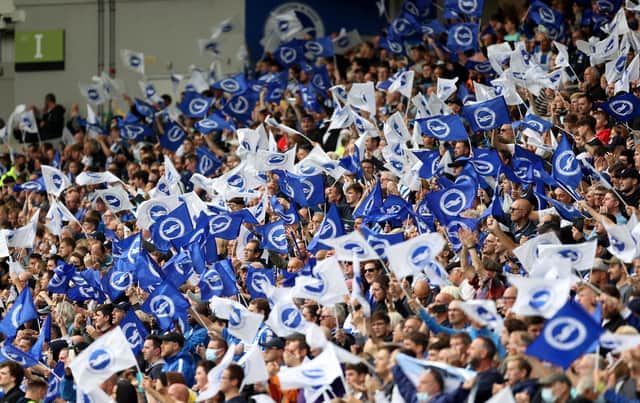 BRIGHTON, ENGLAND - AUGUST 21: Brighton & Hove Albion  fans wave flags before the Premier League match between Brighton & Hove Albion  and  Watford at American Express Community Stadium on August 21, 2021 in Brighton, England. (Photo by Eddie Keogh/Getty Images)