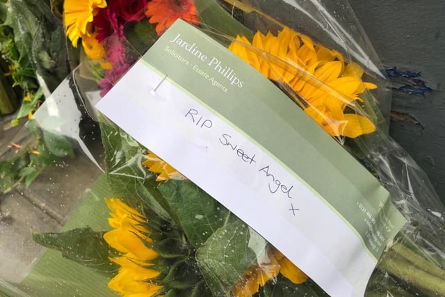 Heartfelt messages of condolences were left with flowers at the site of the crash