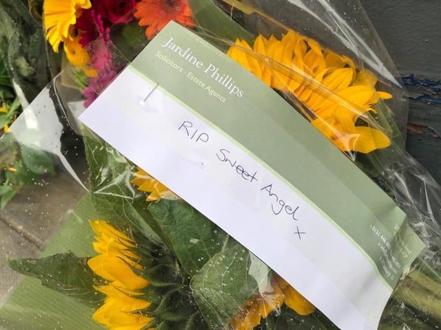 Heartfelt messages of condolences were left with flowers at the site of the crash