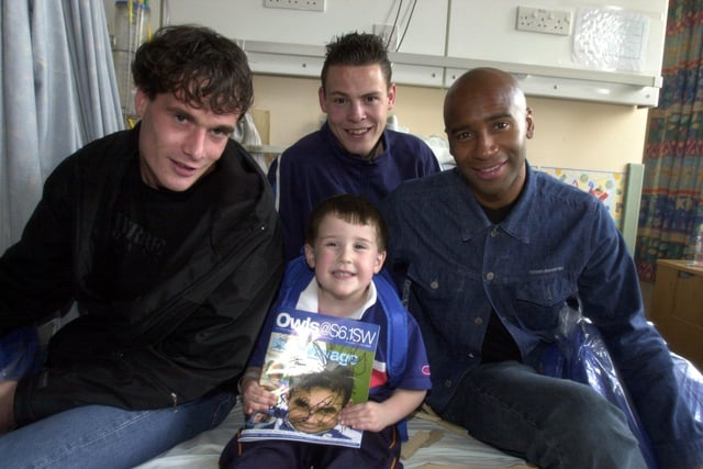 Wednesday players Gerald Sibon, Tony Crane and Danny Maddix with Sheffield Children's Hospital patient Sam Watkins, four, from Ranmoor, at Christmas 2001.