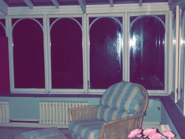 The conservatory hasn't been used in years but still looks clean and cosy.