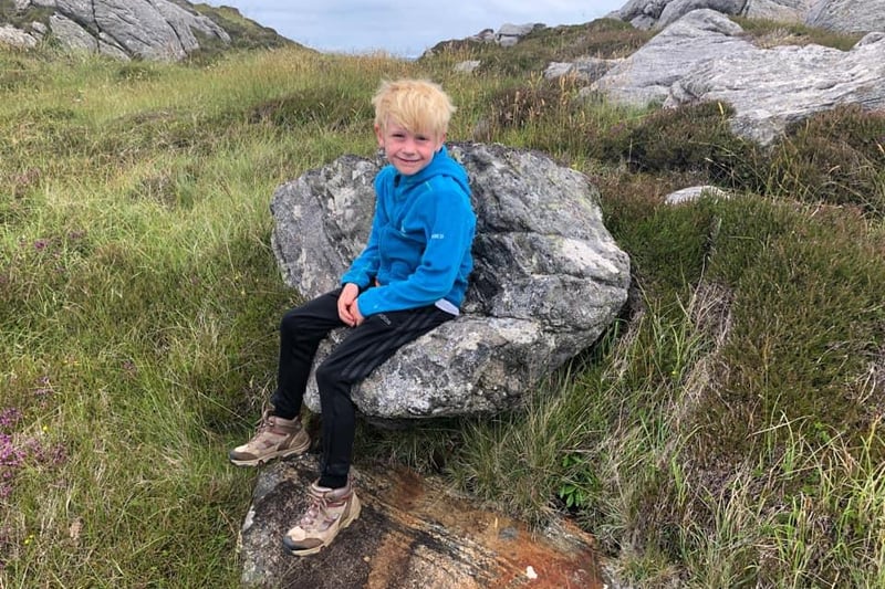 Rebecca Luke's son having a rest on Ben Hogh, on the Isle of Coll.