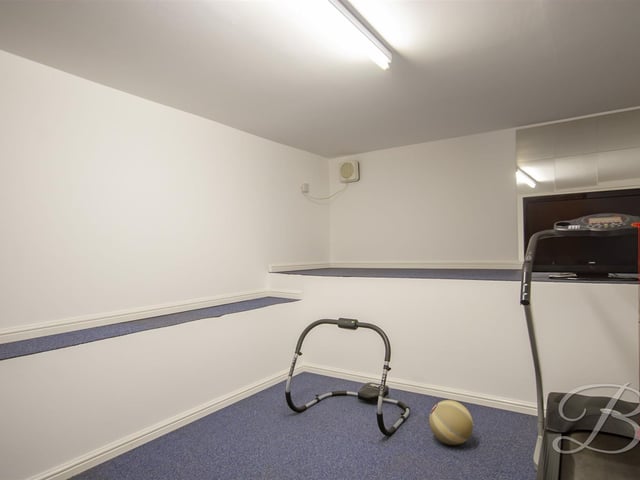There is a large room beneath the lounge, currently being used as a gym.