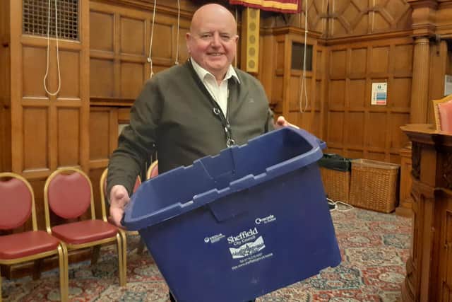 Labour Coun Garry Weatherall with the blue recycling box he brandished at Sheffield City Council's budget-setting meeting. Labour criticised the LibDems over their new blue bin proposal