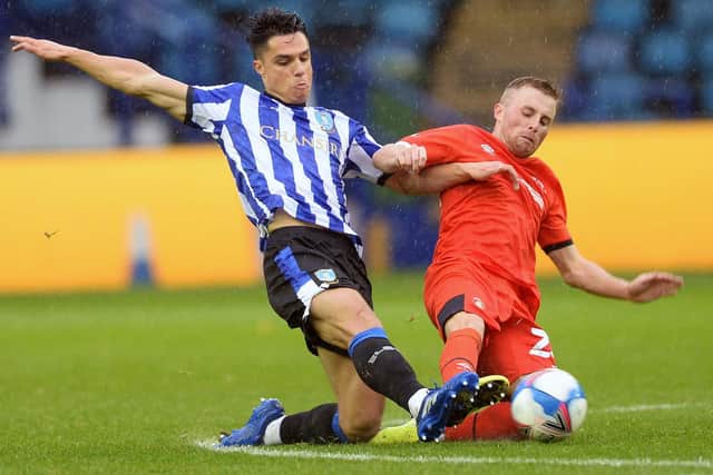 Sheffield United defender Rhys Norrington-Davies, on loan with Luton Town, does battle with Sheffield Wednesday's Joey Pelupessy in the Hatters' 1-0 win over Sheffield Wednesday at Hillsborough on Saturday. Photo: Steve Ellis.