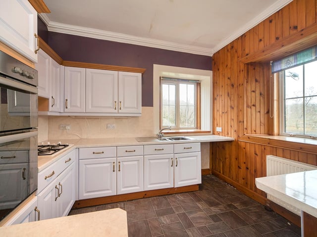 The kitchen has a range of fitted units and also benefits from dual-aspect views