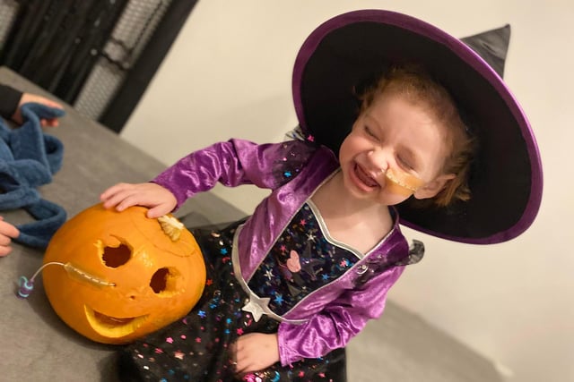 Connie Atkinson and her special pumpkin are ready for any spooky surprises.