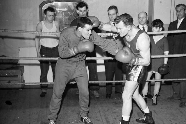 Billy Louden and Angus Thomson spar in the Madison Club Ring at Dalry Boys Club in March 1963.
