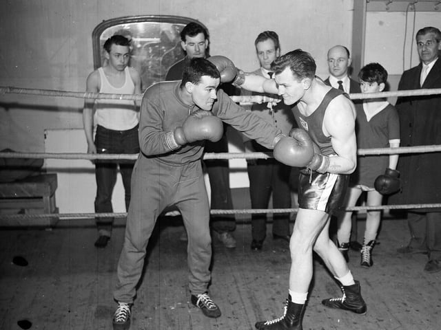 Billy Louden and Angus Thomson spar in the Madison Club Ring at Dalry Boys Club in March 1963.