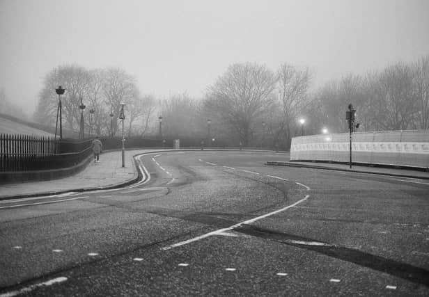 The photographs, posted on their Twitter @HenniPhoto show usually bustling areas of the Old Town with few, or no people in sight.
