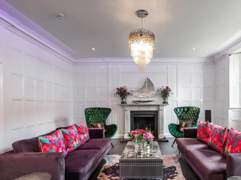 This property comes with eight bathrooms and six reception rooms as well as a huge garden.