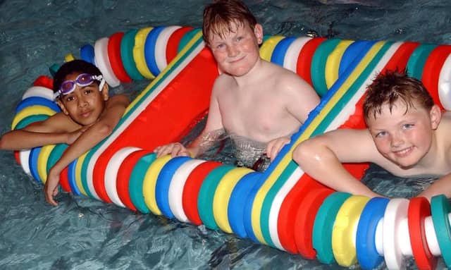 Three boys having fun at Adwick Leisure Centre's pool in 2005.