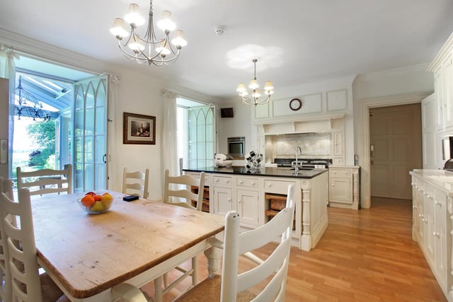 The house boasts two kitchens - this one has Clive Christian units and space for dining