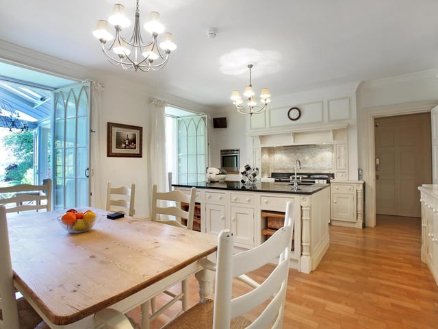 The house boasts two kitchens - this one has Clive Christian units and space for dining