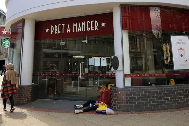 A man sits in the doorway of Pret A Manger, one of several on Fargate that have closed due to coronavirus. Picture: Chris Etchells