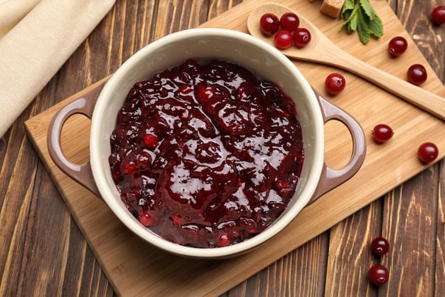 Some choose to dollop this on the side of their Christmas lunches, whereas some give it as miss, but the classic cranberry sauce ranks in the third tier of festive favourites (Photo: Shutterstock)
