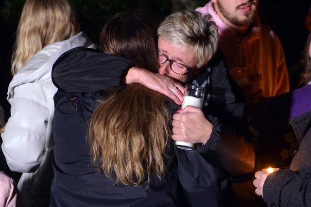 Mum Alison Heaton is comforted by another mourner