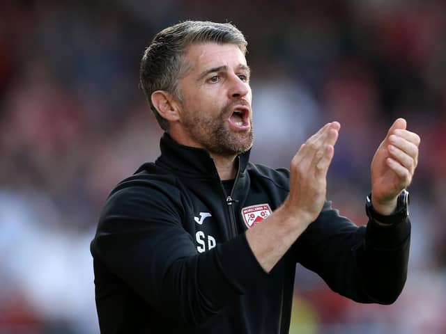 MORECAMBE, ENGLAND - AUGUST 24: Stephen Robinson, Manager of Morecambe reacts during the Carabao Cup Second Round match between Morecambe and Preston North End at Globe Arena on August 24, 2021 in Morecambe, England. (Photo by Charlotte Tattersall/Getty Images)