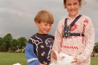 Joshua and Keeley Pink meet Cyril the goat at the Doncaster Deaf Trust Summer Fayre in 1996.