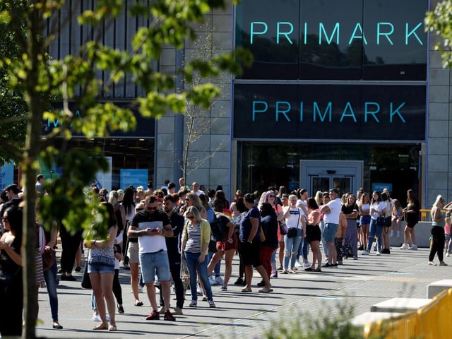 Huge queues form at a Primark store at the Rushden Lakes shopping complex in Northamptonshire as it reopened.