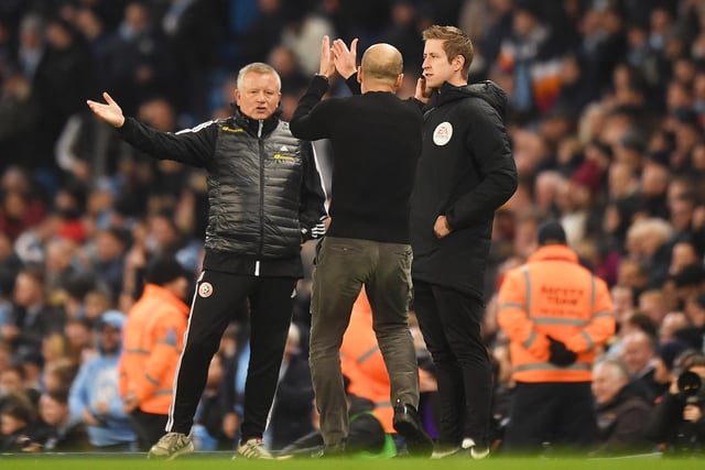 Wilder and iconic Manchester City manager Pep Guardiola share an exchange at the Etihad Stadium in December 2019.