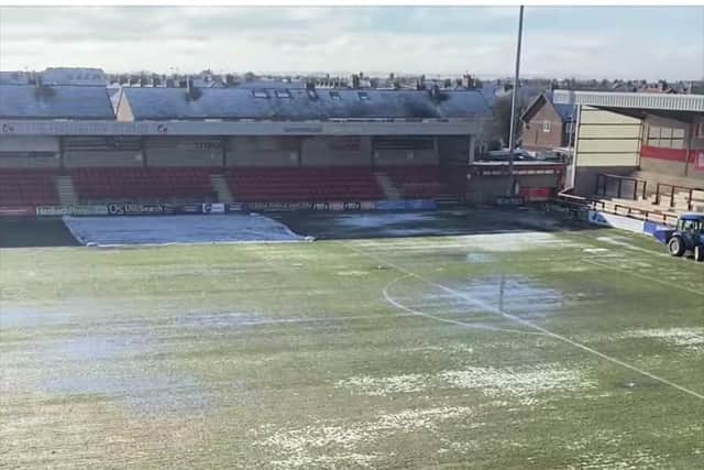 Fleetwood Town's Highbury pitch is covered in water after heavy snowfall over the weekend.