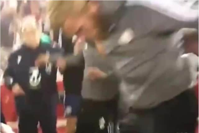 A clip from the video which appears to show Oli McBurnie stamping on a Nottingham Forest fan.