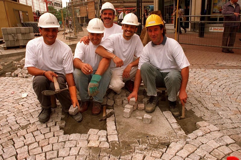 Italian pavers working on the new Fargate design in July 1997