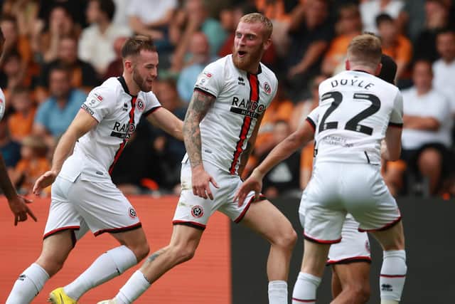 Oliver McBurnie of Sheffield United celebrates scoring the first goal during the Sky Bet Championship match at the MKM Stadium, Kingston upon Hull. Picture credit should read: Simon Bellis / Sportimage