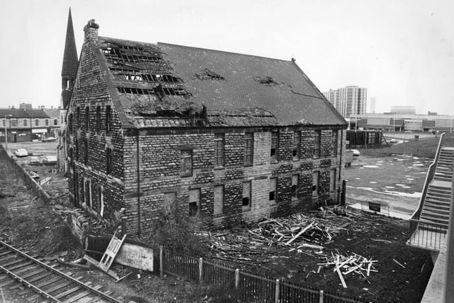 Workmen busy demolishing Jarrow Congregational Church, slate by slate in February 1976..