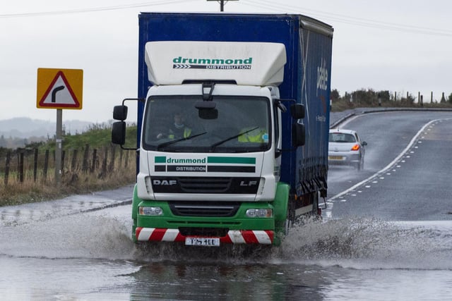 A lorry travelling through a flooded section of the A89 between Armadale and Blackridge in West Lothian.