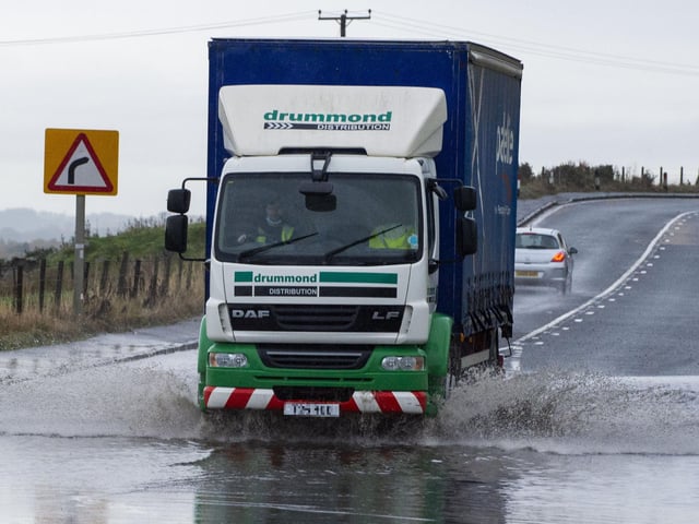 A lorry travelling through a flooded section of the A89 between Armadale and Blackridge in West Lothian.