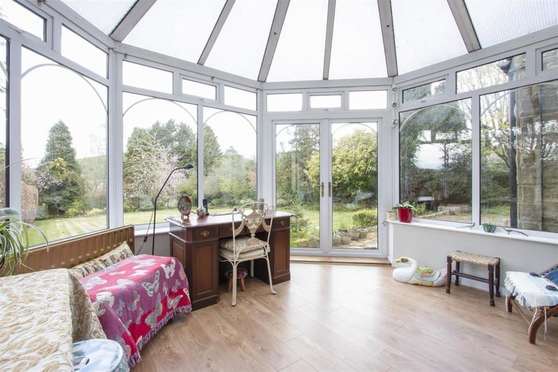 Whatever the weather, you'll be cosy and dry sitting in this conservatory admiring the views of the garden.