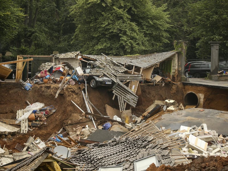 Heavy rains caused mudslides and flooding in the western part of Germany. Multiple have died and dozens are missing as severe flooding in Germany and Belgium turned streams and streets into raging, debris-filled torrents that swept away cars and toppled houses. (David Young/dpa via AP)