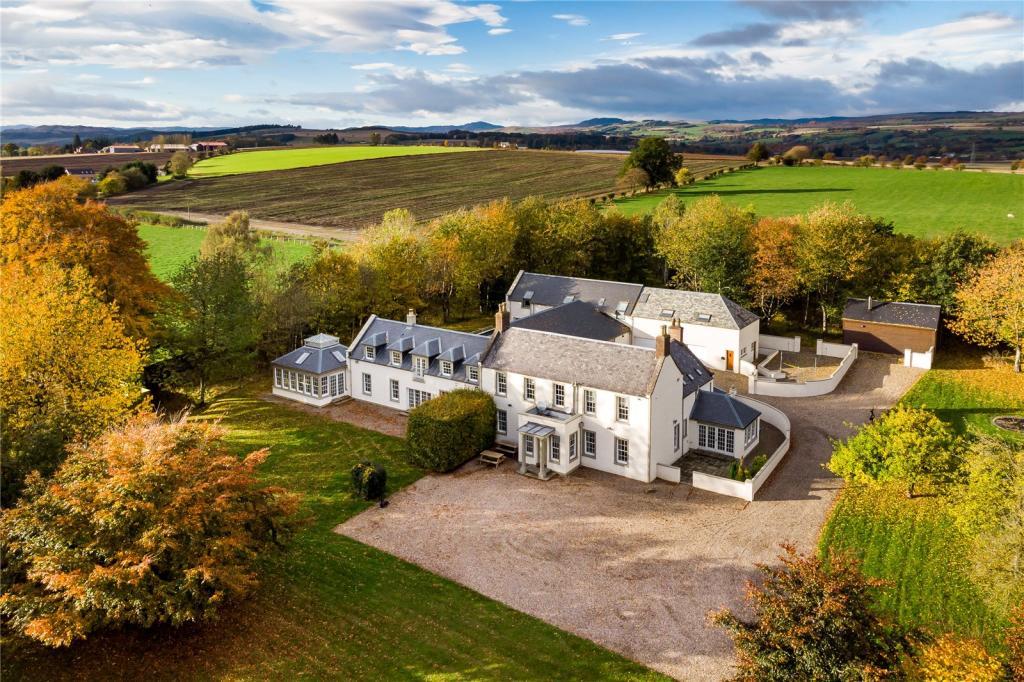 Aerial view of property and grounds.