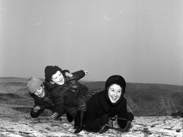 Elizabeth Larner sledging with her two sons on the Braid hills in Edinburgh, January 1966.