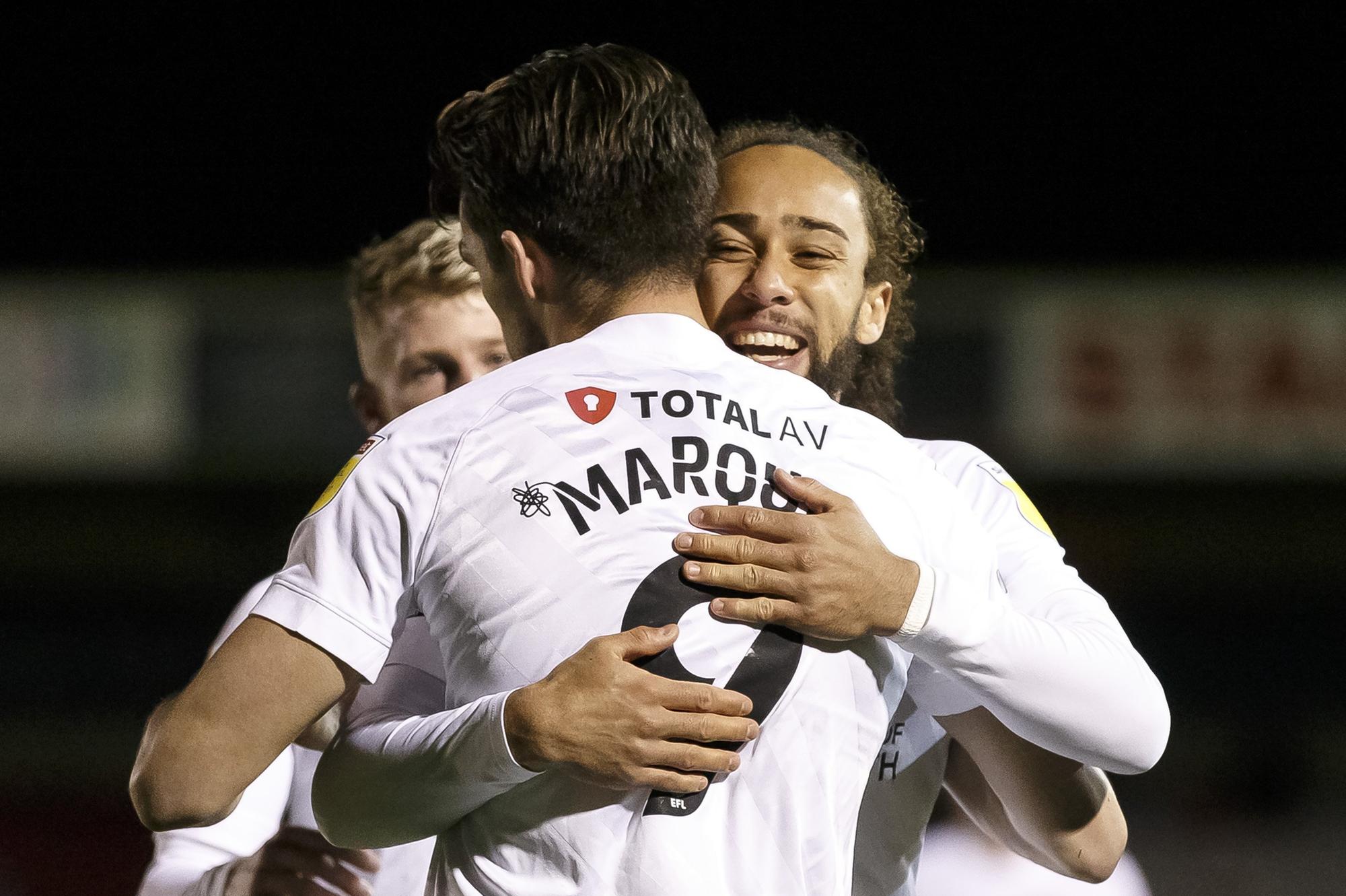 Marcus Harness celebrates with goalscorer John Marquis.  Picture: Daniel Chesterton/phcimages.com