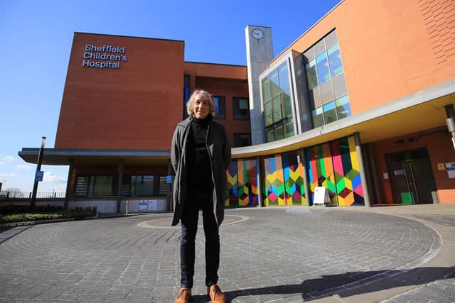 David in front of the hospital's outpatients department, which the charity helped fund. Picture: Chris Etchells