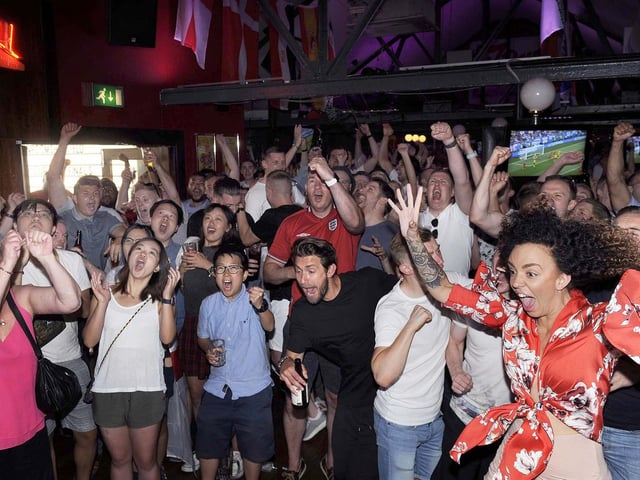 Jubilant England fans in the Common Room in Sheffield city centre watching the World Cup quarter final win over Sweden, on July 7, 2018